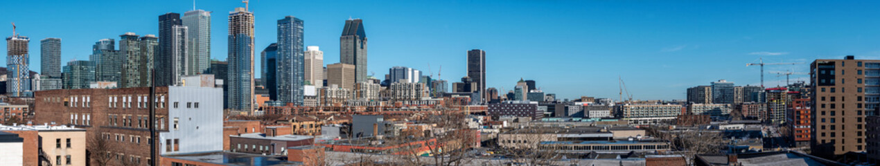 Panoramic view of a Montreal downtown with blue sky