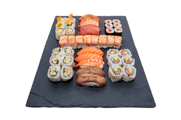 Artfully Delicious: Beautiful Assortment of Fresh Sushis Presented on Black Slate for Restaurant Menu