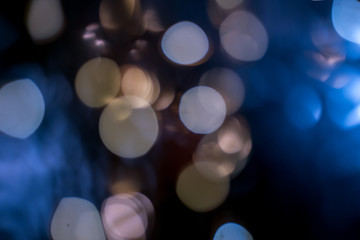 Photo of bokeh lights on black background. Blue lights, mint color.