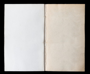 Antique book unfolded on the Endpaper, showing aged textured paper inside, isolated on black background.