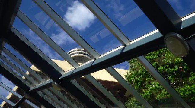 Gimbal Shot Of Windows Looking Towards Skylon Tower During A Sunny Day
