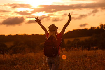 Fototapeta na wymiar Happy woman life at sunset in the yellow field