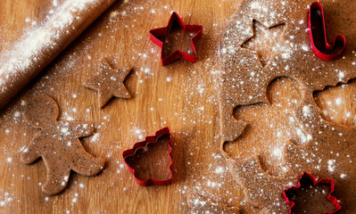 Christmas cookies baking including gingerbread man and star with tree