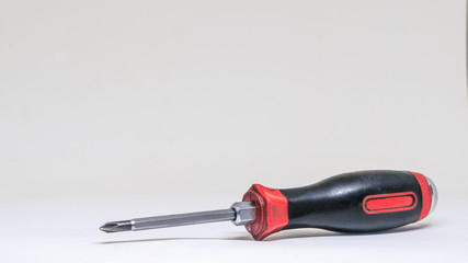 Screwdriver lie on a white background. Isolated view.