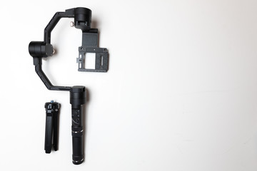 DSLR camera gimbal three-axis motorized stabilizer Tripod System on a white background, isolated