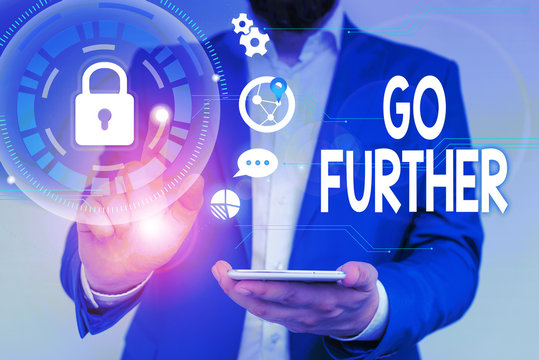 Word writing text Go Further. Business photo showcasing To move to a greater distance or overcome your limitations Male human wear formal work suit presenting presentation using smart device