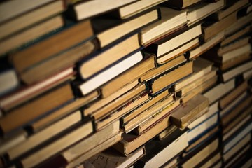A huge pile of different books in the library. A library full of books. Reading. A huge number of...