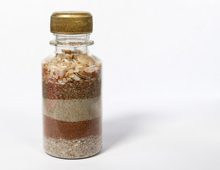 Sea sand shells in a bottle