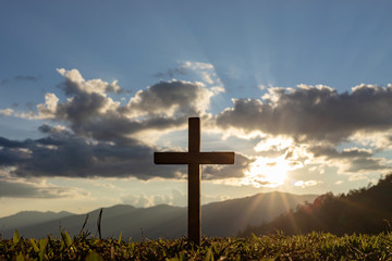 Silhouette cross on mountain at sunset background.Crucifixion Of Jesus Christ - obrazy, fototapety, plakaty