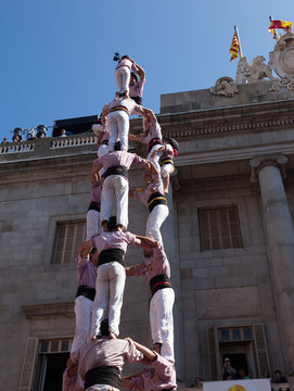 Castellers make castell in front of the ayuntamiento building  in Barcelona