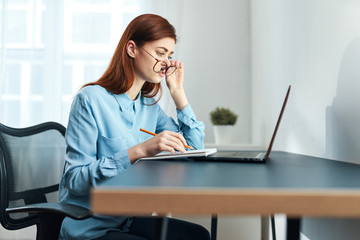 businesswoman talking on phone in office