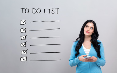 To do list with thoughtful young woman holding a smartphone