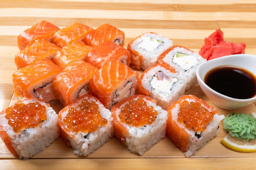 Sushi set with salmon. Philadelphia., with caviar. With ginger and wasabi. Close-up.