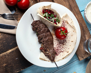 tasty meal Kabab, with tomato, onion and  pomegranate