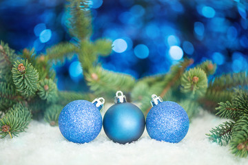 Naklejka na ściany i meble Christmas and New Year holiday background. Christmas balls on a blue background.