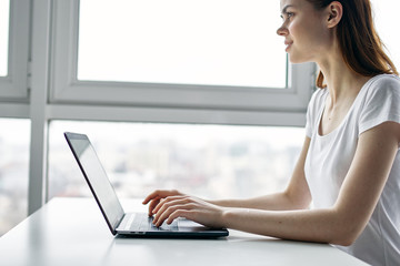 woman working on laptop at home