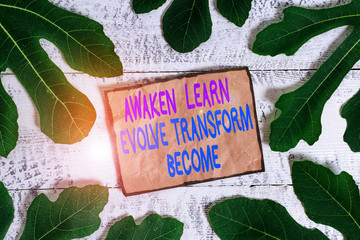 Writing note showing Awaken Learn Evolve Transform Become. Business concept for Inspiration...