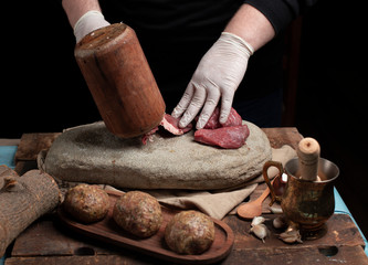 Male chef seasoning filet mignon steaks