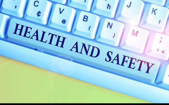 Handwriting text writing Health And Safety question. Conceptual photo regulations and procedures intended to prevent accident White pc keyboard with empty note paper above white background key copy