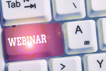 Handwriting text Webinar. Conceptual photo defined as seminar conducted over the Internet Web conferencing White pc keyboard with empty note paper above white background key copy space