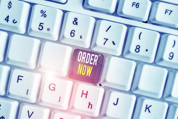 Word writing text Order Now. Business photo showcasing service restaurants or stores provide to get what you need home White pc keyboard with empty note paper above white background key copy space