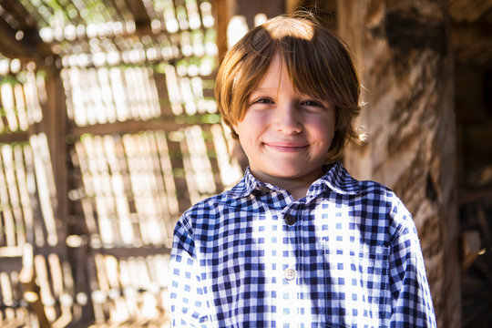 portrait of 6 year old boy in contrast light and shadow