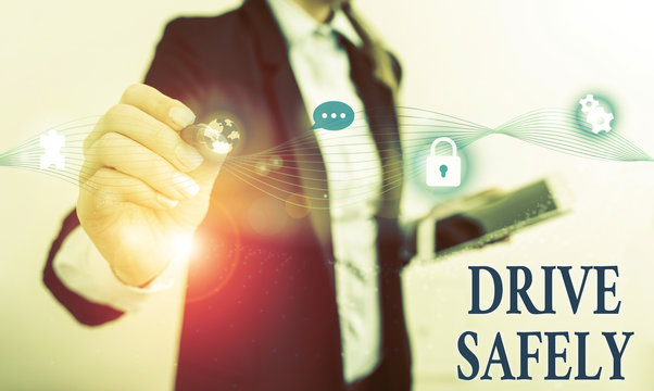 Handwriting text writing Drive Safely. Conceptual photo you should follow the rules of the road and abide laws Female human wear formal work suit presenting presentation use smart device