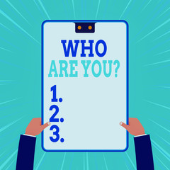 Conceptual hand writing showing Who Are You Question. Concept meaning asking about someone identity or demonstratingal information Two male hands holding electronic device geometrical background