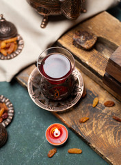 cup of black tea with wooden background