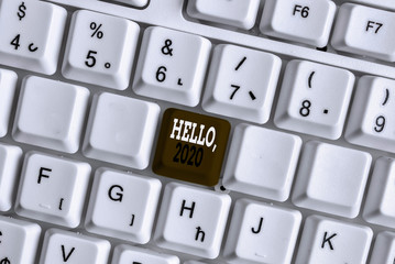 Word writing text Hello 2020. Business photo showcasing expression or gesture of greeting answering the telephone White pc keyboard with empty note paper above white background key copy space