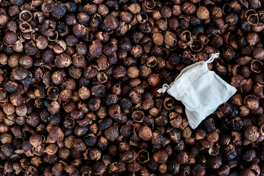 High angle close up of dried brown soap nuts.