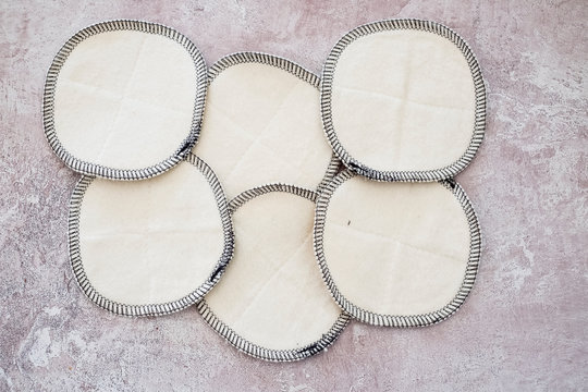 High angle close up of homemade white cosmetic pads.