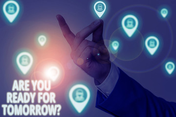 Conceptual hand writing showing Are You Ready For Tomorrow Question. Concept meaning Preparation to the future Motivation Male wear formal work suit presenting presentation smart device