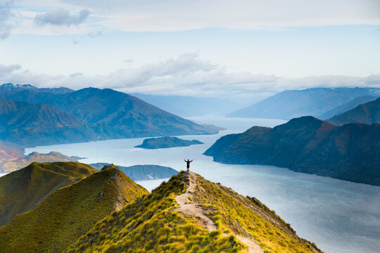 Roys peak mountain hike in Wanaka New Zealand. Popular tourism travel destination. Concept for hiking travel and adventure. New Zealand landscape background.