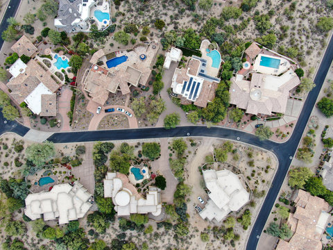 Aerial Top View Of Upscale Luxury Homes With Pool And Tennis Court In Scottsdale, Phoenix, Arizona