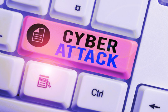 Word writing text Cyber Attack. Business photo showcasing attempt by hackers to damage or destroy a computer network White pc keyboard with empty note paper above white background key copy space