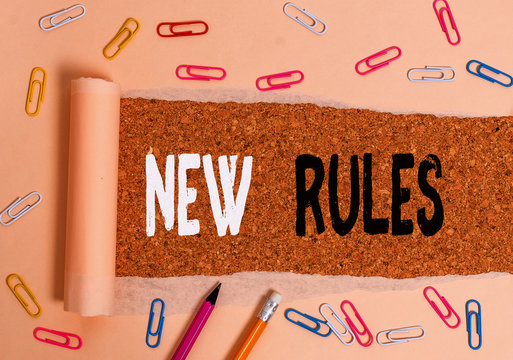 Handwriting text writing New Rules. Conceptual photo A state of changing an iplemented policy for better upgrade