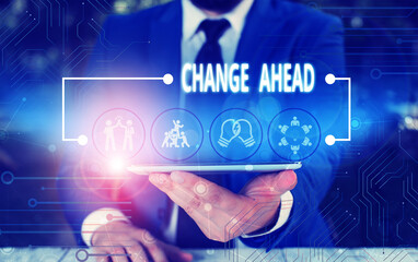 Writing note showing Change Ahead. Business concept for the act or instance of making or becoming different or Male wear formal work suit presenting presentation smart device