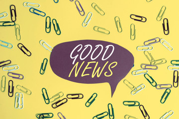 Handwriting text Good News. Conceptual photo Someone or something positive,encouraging,uplifting,or desirable Flat lay above empty paper with copy space and colored paper clips