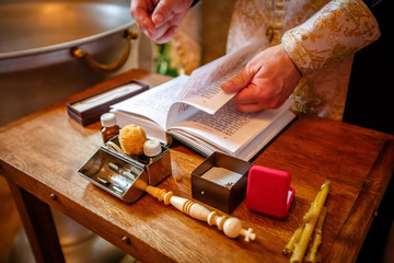 The sacrament of baptism. Attributes of an Orthodox priest for baptism. Baptism in the font. Child and God. Holy water. baptism Christening the baby