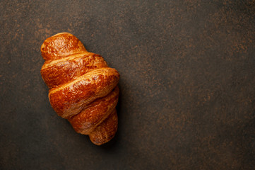 croissant on a stone background with copy space for your text