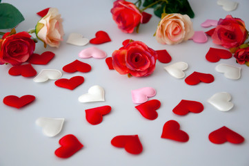 Fototapeta na wymiar Hearts and flowers on the background. Valentine's Day.