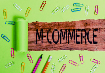 Conceptual hand writing showing M Commerce. Concept meaning commercial transactions conducted...