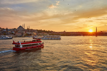 Fototapeta premium Bosphorus strait with ferry boats on the sunset in Istanbul