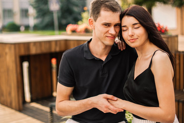 Loving couple hugging in the street.