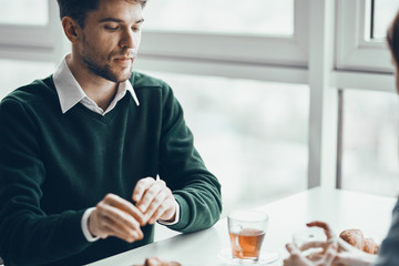 businessman drinking coffee in office