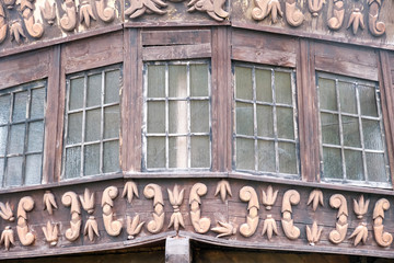 The stern of a vintage sailing ship with windows on board. Rear view aboard a sailboat.