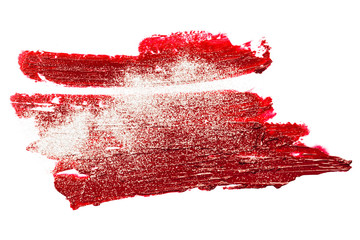 Smear of red lipstick with glitter. Cosmetics concept. Element isolated on white.