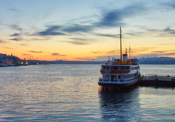 Fototapeta na wymiar Bosphorus strait with ferry boats on the sunset in Istanbul