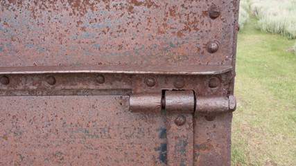 A rusty metal hinge background